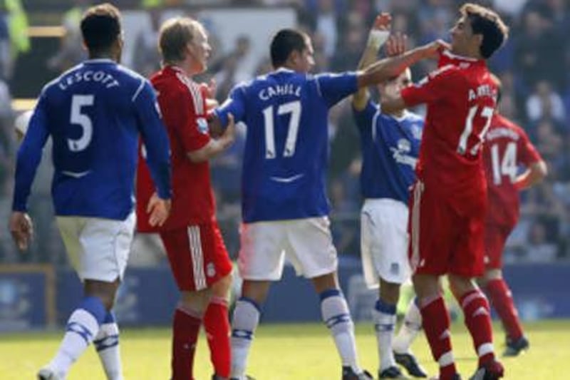 Everton's Tim Cahill, centre, and Liverpool's Alvaro Arbeloa, right, square up to one another following a foul during the recent Merseyside derby between Everton and Liverpool.