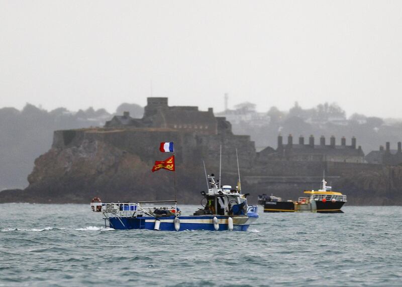 ALTERNATIVE CROP - French fishing boats protest in front of the port of Saint Helier off the British island of Jersey to draw attention to what they see as unfair restrictions on their ability to fish in UK waters after Brexit, on May 6, 2021.  Around 50 French fishing boats gathered to protest at the main port of the UK island of Jersey on May 6, 2021, amid fresh tensions between France and Britain over fishing. The boats massed in front of the port of Saint Helier to draw attention to what they see as unfair restrictions on their ability to fish in UK waters after Brexit, an AFP photographer at the scene said.  - ALTERNATIVE CROP
 / AFP / Sameer Al-DOUMY / ALTERNATIVE CROP
