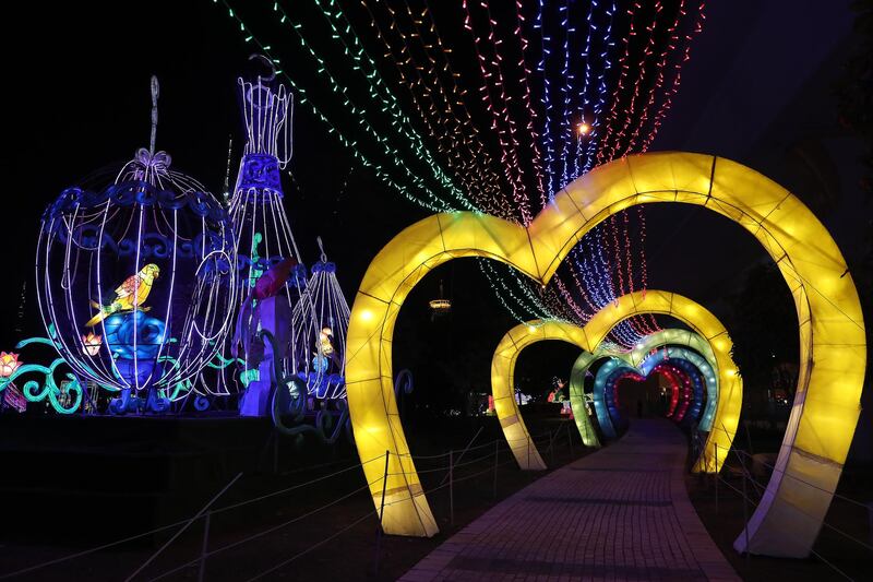 DUBAI, UNITED ARAB EMIRATES , October 14 – 2020 :- View of the colourful light figures at the Dubai Garden Glow season 6 which opened on 12th October at the Zabeel park in Dubai. No sitting allowed on the benches as a precautionary measure against the spread of coronavirus. Security at the entrance gate checks the body temperature of all the visitors. (Pawan Singh / The National) For Life Style/Online/Instagram/Big Picture. Story by Evelyn Lau