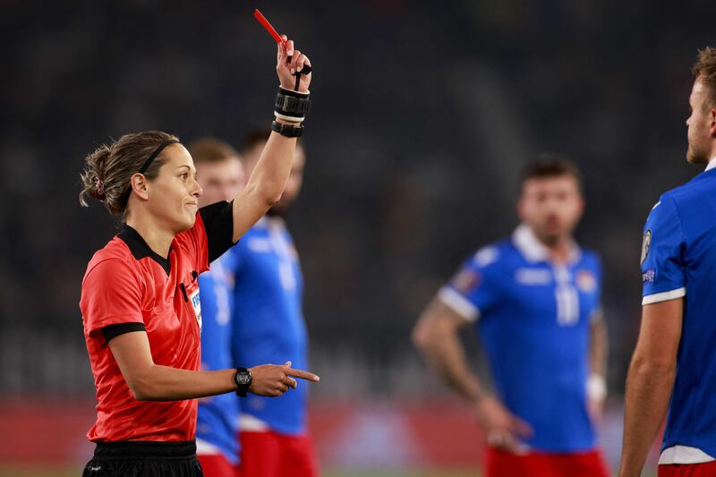 Croatian referee Ivana Martincic shows Liechtenstein's defender Jens Hofer a red card. AFP