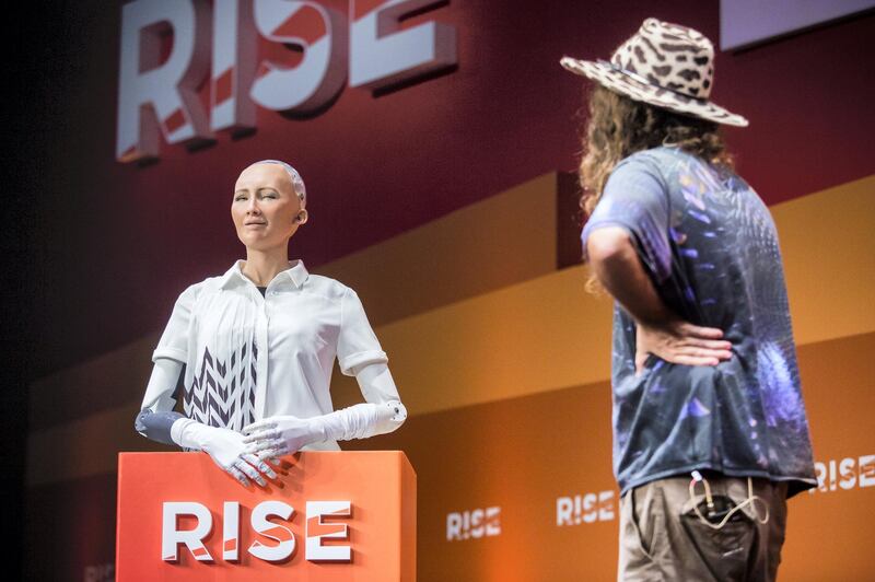 Chief scientist of Hanson Robotics, Ben Goertzel (R), interacts with "Sophia the Robot" (L) during a discussion about the future of humanity in a demonstration of artificial intelligence (AI) by Hanson Robotics at the RISE Technology Conference in Hong Kong on July 12, 2017.
Artificial intelligence is the dominant theme at this year's sprawling RISE tech conference at the city's harbourfront convention centre, but the live robot exchange took the AI debate to another level. / AFP PHOTO / ISAAC LAWRENCE