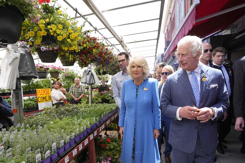 Britain's Prince Charles and Camilla, Duchess of Cornwall, tour the Byward Market in Ottawa on May 18, 2022. AFP