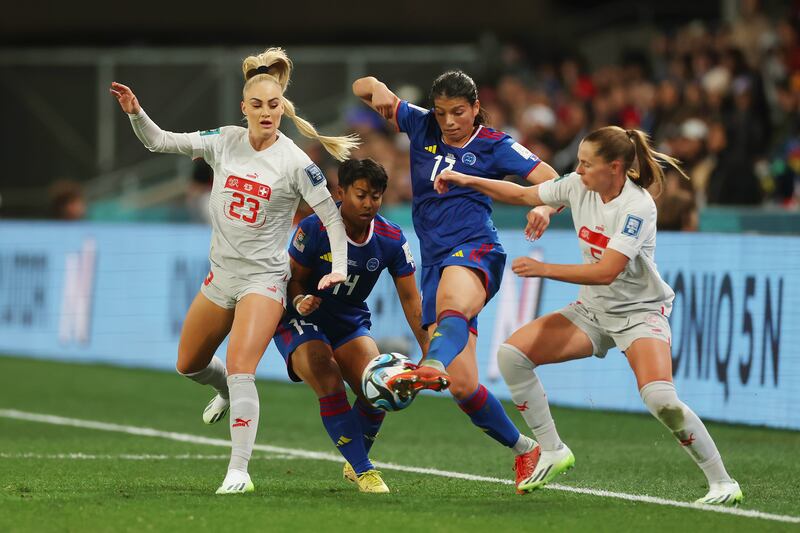 Alicia Barker of Philippines competes for the ball against Alisha Lehmann and Noelle Maritz of Switzerland. Getty Images