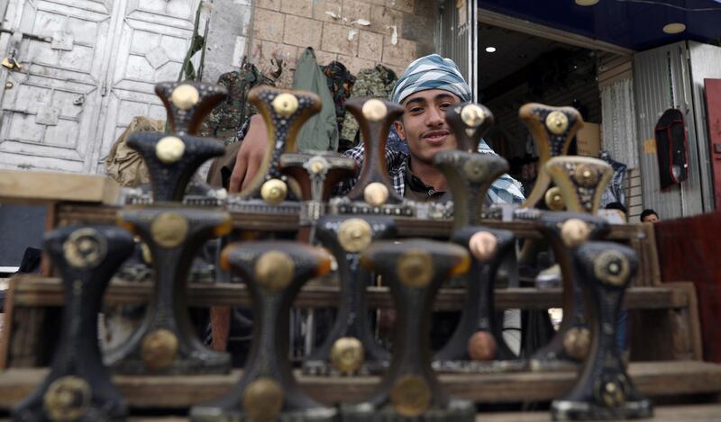 A vendor selling traditional khanjar daggers waits for customers in the old quarter of Sanaa, Yemen. Reuters