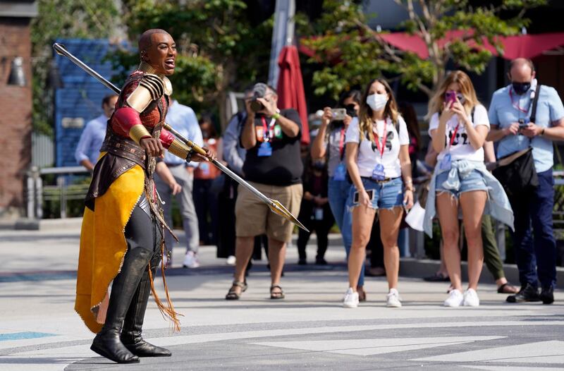 A character from 'Black Panther' performs during 'The Warriors of Wakanda: The Disciplines of the Dora Milaje' show at the Avengers Campus media preview on June 2, 2021. AP