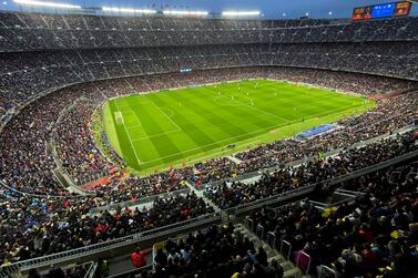 Spectators crowd the Camp Nou stadium during the Women's Champions League quarter final, second leg soccer match between Barcelona and Real Madrid in Barcelona, Spain, Wednesday, March 30, 2022.  A world-record crowd for a women's soccer match of more than 91,000 people watched Barcelona defeat Real Madrid 5-2 in the Champions League at the Camp Nou Stadium.  (AP Photo / Maria Angela Angles)