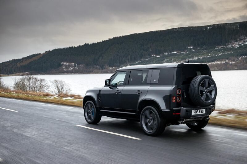 A Defender V8 on tarmac.