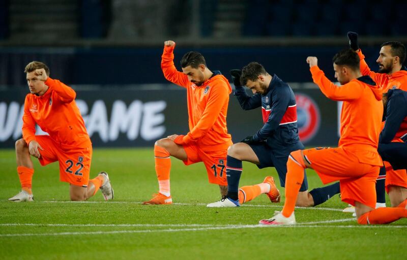 Players take a knee before kick off. Reuters