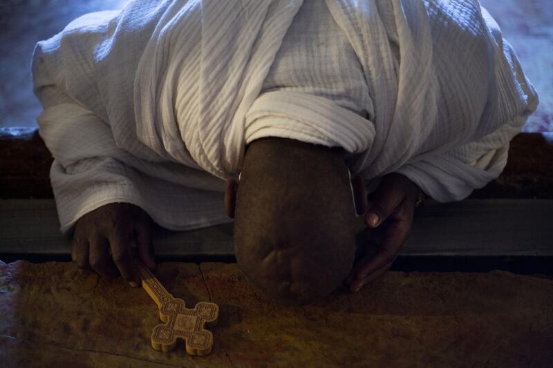 A Christian worshipper prays in the Church of the Holy Sepulchre in Jerusalem's old city. AP