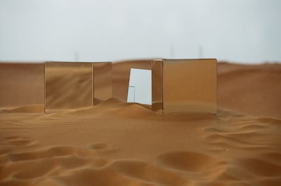 Ivan Ilinskii's futuristic mirror cubes constructed in the desert near Sharjah's Mleiha village before they were taken down. Photo: Inloco