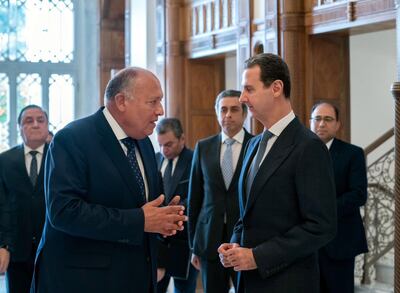 Syria's President Bashar Al Assad, right, with Egyptian Foreign Minister Sameh Shoukry during the latter's visit to Syria in February. EPA