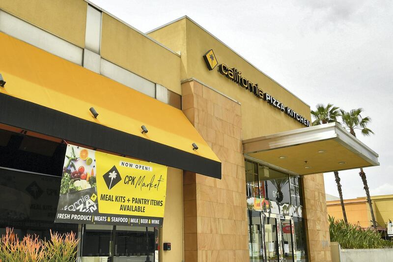 LOS ANGELES, CALIFORNIA - APRIL 17: California Pizza Kitchen sells groceries to stay afloat in reaction to the coronavirus on April 17, 2020 in Burbank, California.   Amy Sussman/Getty Images/AFP