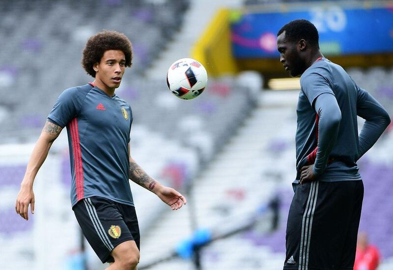 Belgium midfielder Axel Witsel (L) and Belgium forward Romelu Lukaku take part in a training session at the Stadium Municipal in Toulouse, southern France, on June 25, 2016, on the eve of the Euro 2016 football match between Hungary and Belgium. Emmanuel Dunand / AFP