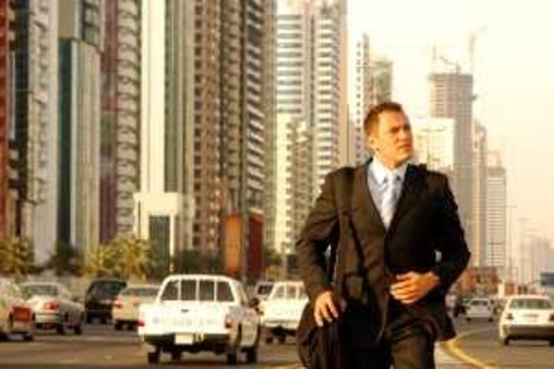 Businessman walking on Shaikh Zayed Road in Dubai

credit
grapheast