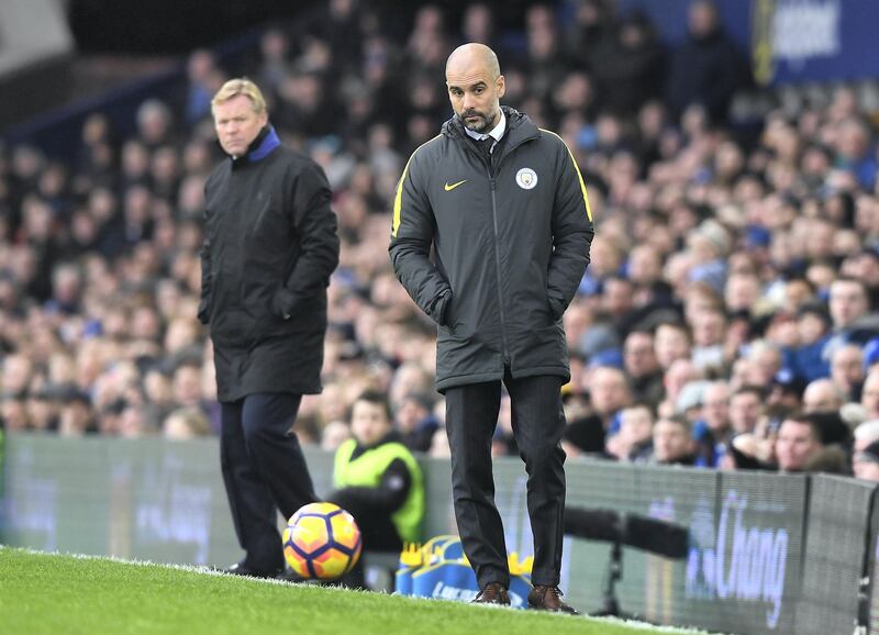 LIVERPOOL, ENGLAND - JANUARY 15:  (R-L) Josep Guardiola, Manager of Manchester City and Ronald Koeman, Manager of Everton look on during the Premier League match between Everton and Manchester City at Goodison Park on January 15, 2017 in Liverpool, England.  (Photo by Michael Regan/Getty Images)