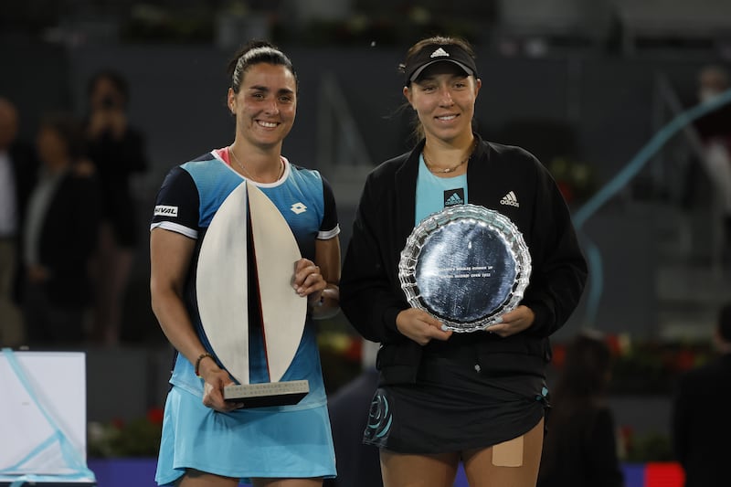 Ons Jabeur and Jessica Pegula pose for photos during the trophy ceremony. EPA