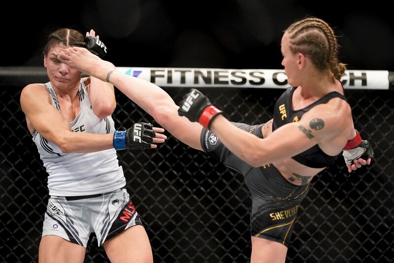 Valentina Shevchenko, right, throws a kick to the head of Lauren Murphy. AP Photo