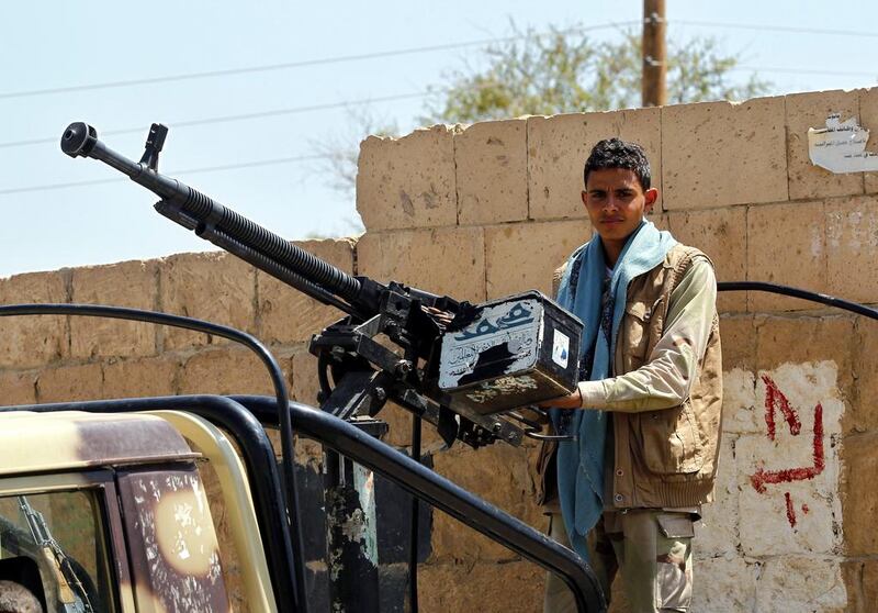 A young Houthi fighter mans a heavy calibre machine gun at a checkpoint in Sanaa on October 6, 2015. Yahya Arhab