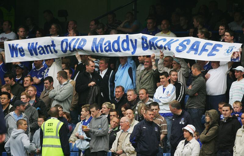 Everton fans hold a banner appealing for the safe return of Madeleine McCann before a Premier League match in May 2007. She was a supporter of the club. 