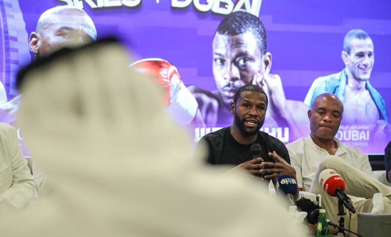 Five-weight former world champion boxer Floyd Mayweather, left, alongside former UFC middleweight champion Anderson Silva, during a press conference at Dubai Sports Council. EPA