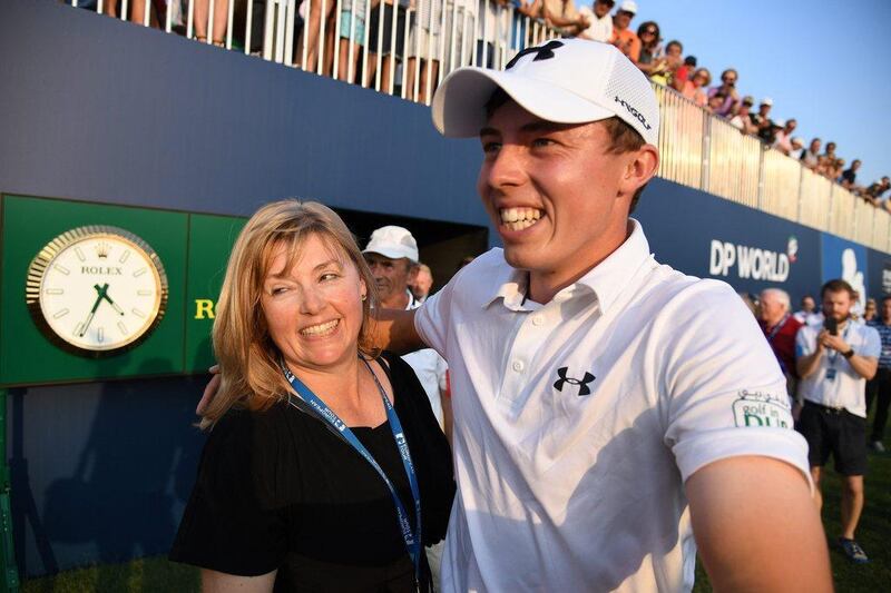 Mattew Fitzpatrick celebrates with his mother Sue after winning the DP World Tour Championship. Ross Kinnaird / Getty Images