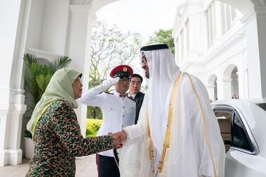 Sheikh Mohamed bin Zayed, Crown Prince of Abu Dhabi and Deputy Supreme Commander of the Armed Forces, is received by President of Singapore Halimah Yacob, at the Istana on Thursday. Courtesy Sheikh Mohamed bin Zayed Twitter