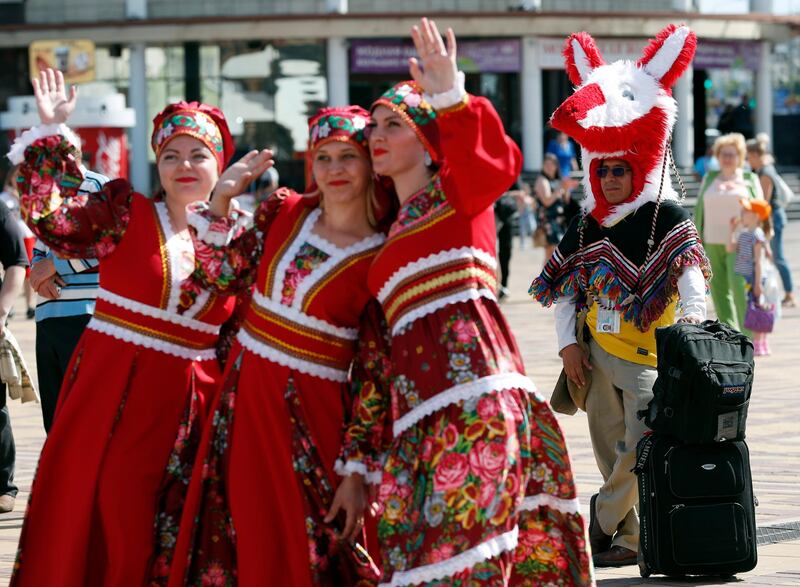 epa06815530 A fan of Colombia with his luggage performers in Mordovian traditional costumes in Saransk, Russia, 17 June 2018. Colombia will face Japan in the FIFA World Cup 2018 group H preliminary round soccer match at Mordovia Arena in Saransk, Russia, 19 June 2018.  EPA/RUNGROJ YONGRIT