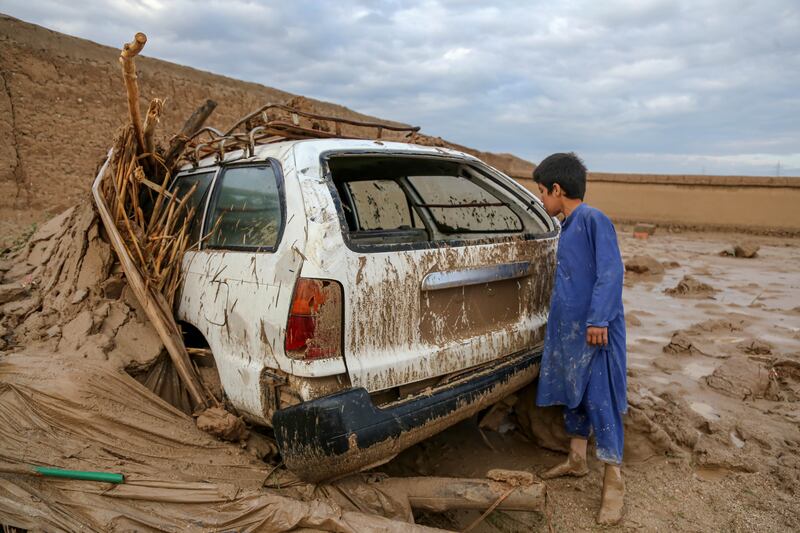 A car is stuck in mud after flash flooding hit Shahrak Muhajireen village in Baghlan, Afghanistan, on May 10. EPA