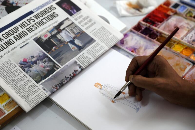 DUBAI , UNITED ARAB EMIRATES , May 14 – 2020 :- Artist Atul Panase making painting from the photo published in The National newspaper at his home studio in Deira Dubai. He is from India and based in Dubai for more than two decades. He was one of curators for World Art Dubai in 2017 and 2018. He is also the UAE Country Leader since last 5 years for the team of watercolorists for FabrianoInAcquarello and UrbinoInAcquerello international watercolor festivals which happen annually in Italy. He started the art activity  #pickanypicandpaint from the newspaper during the stay home era in the UAE because of COVID 19 pandemic. In this art activity which is trending with the hash tag #pickanypicandpaint involves more than 80 artists locally and internationally so far as the number is growing day by day. People here and also from other countries are participating and painting from the piece of newspapers. (Pawan Singh / The National) For Arts & Life/Online/Instagram.  Story by Katy Gillett