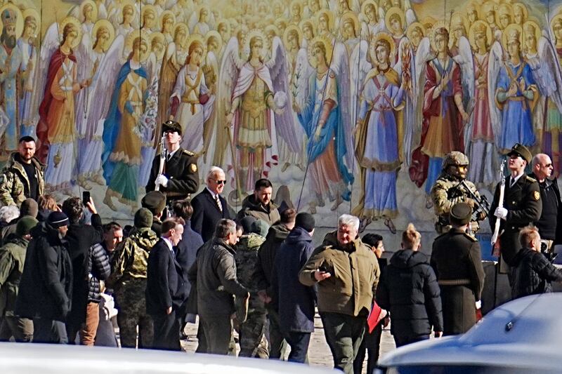 Mr Biden visits St Sophia Cathedral in the Ukrainian capital, where he laid a wreath. Reuters