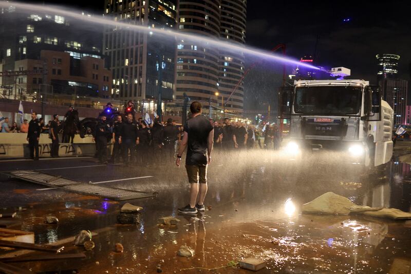 People take part in a demonstration after the Tel Aviv police chief resigned. Reuters