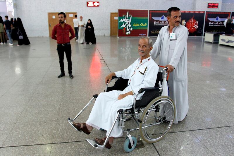 An Iraqi pilgrim arrives at the airport in Najaf on July 31, 2018, before his flight to go attending the annual Hajj pilgrimage. AFP