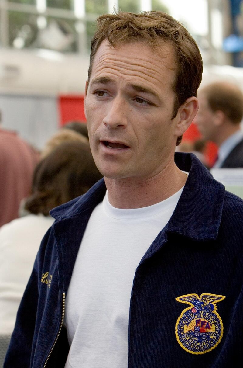 Luke Perry talks to attendees at the Sustainable Biodiesel Summit in San Diego while wearing his Future Farmers of America (FFA) jacket, February 6, 2006. Photo: Reuters