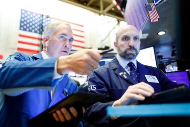 Traders work on the floor of the New York Stock Exchange on February 27. EPA