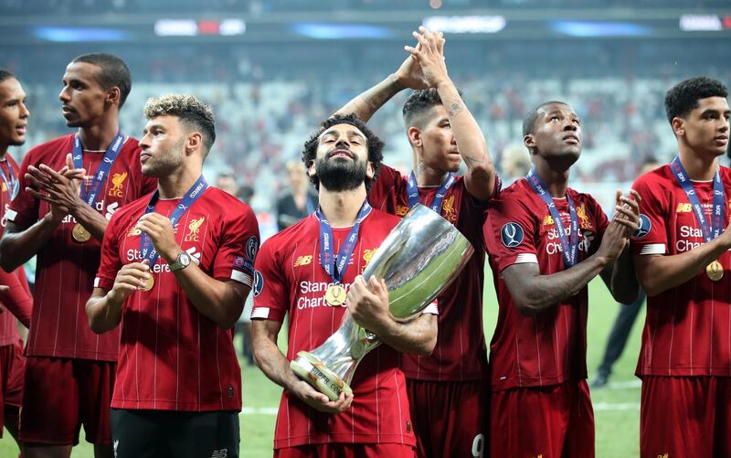 Liverpool's Mohamed Salah celebrates with the trophy. PA Wire