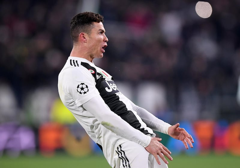 Juventus' Cristiano Ronaldo celebrates after scoring a penalty to make it 3-0 on the night and send the Italian side through to the Champions League quarter-finals 3-2 on aggregate. AFP