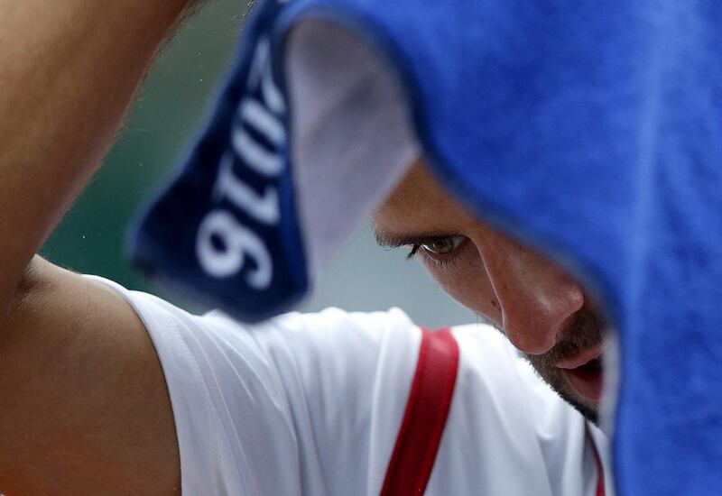 Novak Djokovic of Serbia reacts as he plays against Roberto Bautista Agut of Spain. Yoan Valat / EPA