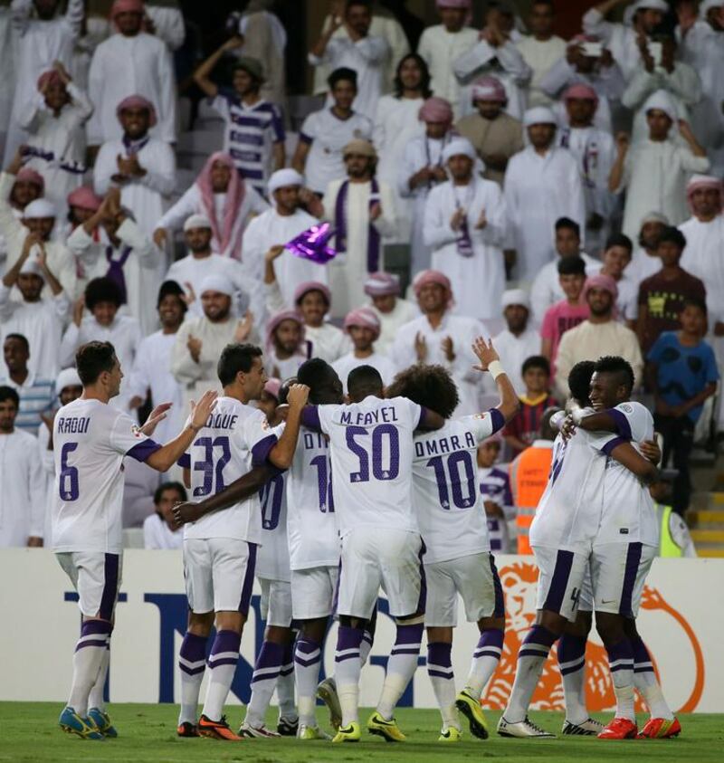 Al Ain players celebrate after one of their goals on Tuesday night against Al Jazira in the Asian Champions League. Karim Sahib / AFP / May 13, 2014