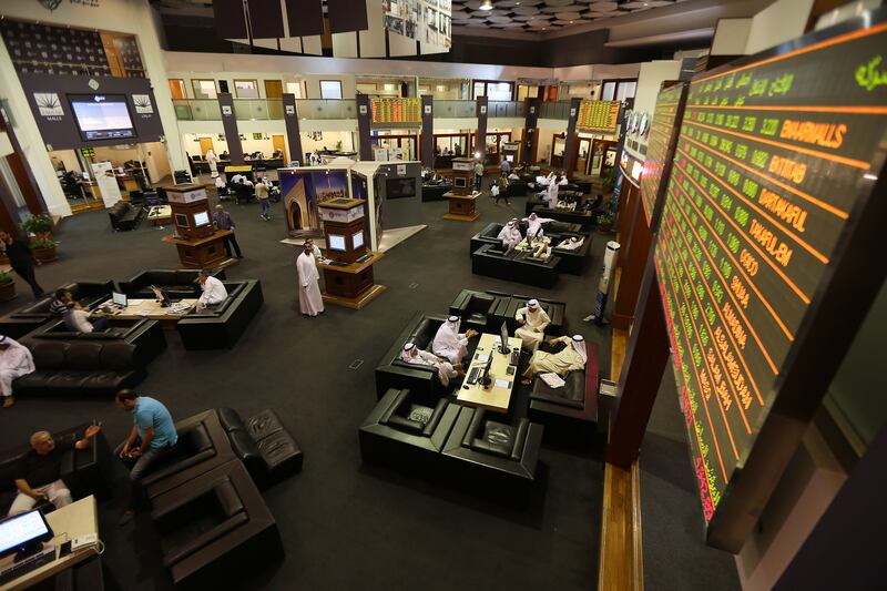 DUBAI , UNITED ARAB EMIRATES Ð Oct 12 , 2014 : Traders doing business in the Dubai Financial Market at Dubai World Trade Centre in Dubai. ( Pawan Singh / The National ) For Business. 
