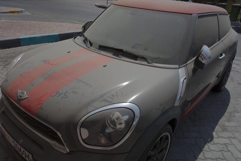 A Mini Cooper in Khalidiya, Abu Dhabi. Some residents are being fined and their cars being towed away for as a result of dirty and or abandoned cars being left in car parks around the capital. Delores Johnson / The National