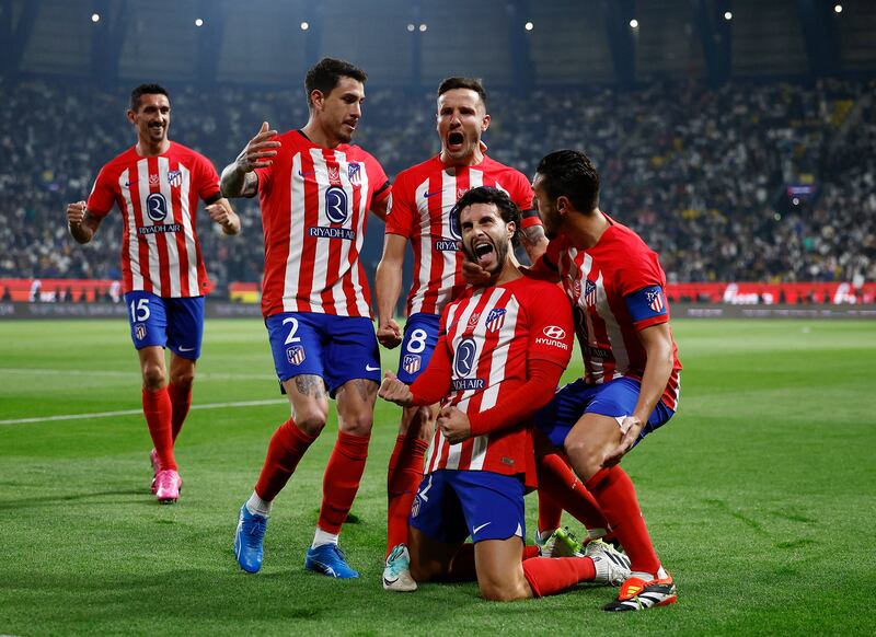 Mario Hermoso celebrates with teammates scoring Atletico's first goal. Reuters