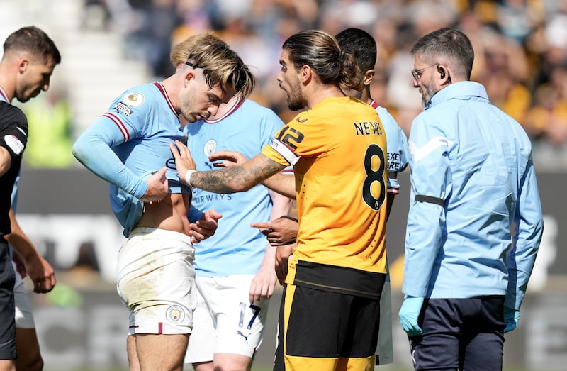 Jack Grealish shows his stud marks to Wolves' Ruben Neves. EPA