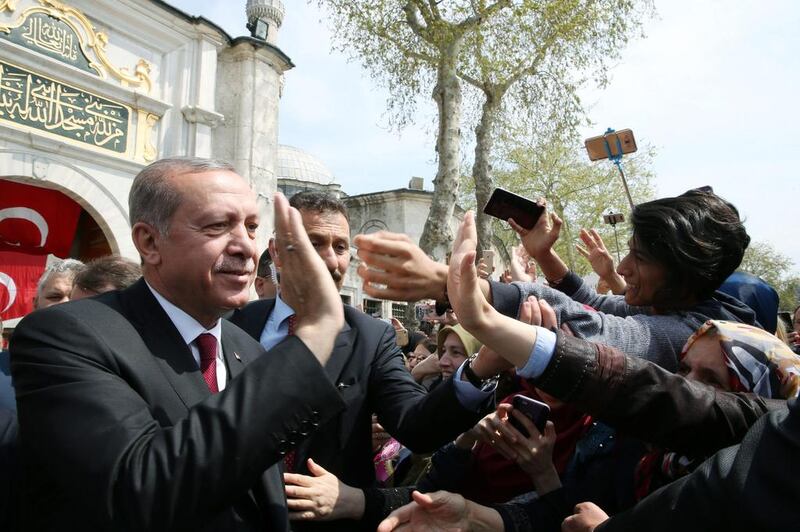 Turkish president Recep Tayyip Erdogan greeting his supporters as he leaves Eyup Sultan mosque in Istanbul, Turkey on April 17, 2017. Yasin Bulbul / Presidential Palace / Handout via Reuters