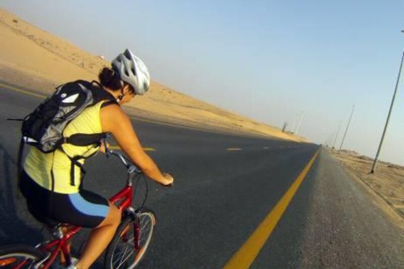 Dina Ghandour trains on Al Qudra Road in preparation for Cycling4Gaza.