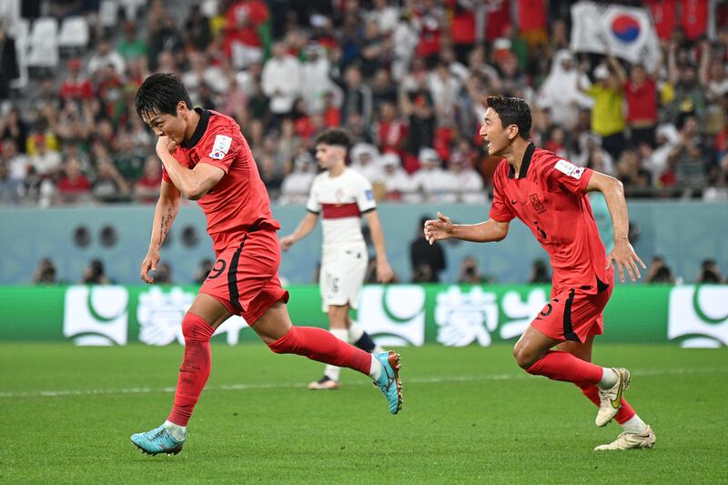 Kim Young-gwon celebrates scoring for South Korea.