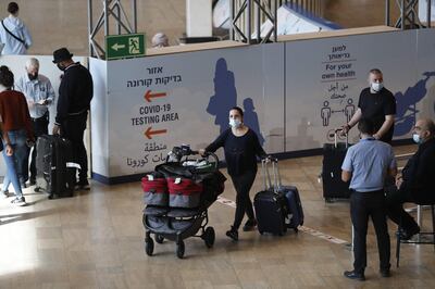 Passengers arrive at Israel's Ben Gurion Airport. AFP