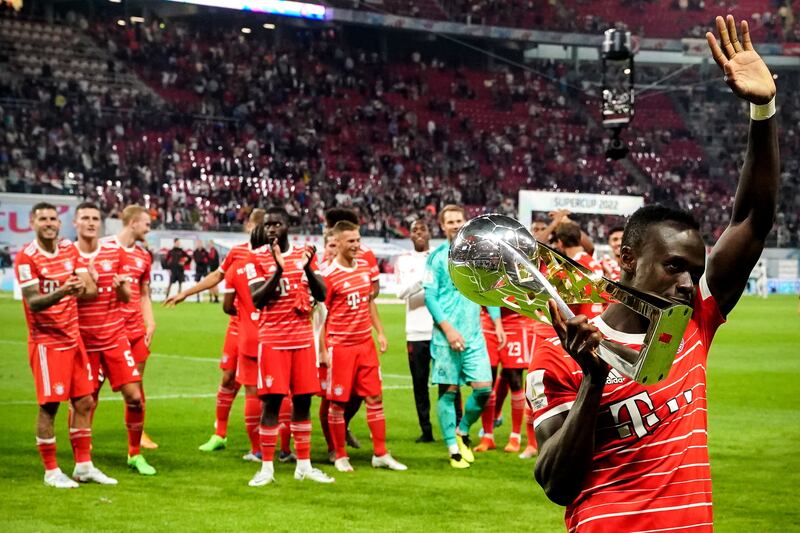 Sadio Mane celebrates with the Supercup trophy following Bayern's win over RB Leipzig. EPA