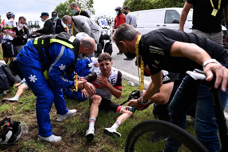 Marc Hirschi receives medical care after a mass crash during the 1st stage of the Tour de France.