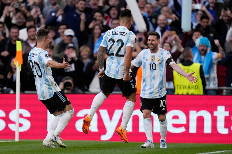 Argentina's Lautaro Martinez, centre, celebrates with his teammates Lionel Messi, right, and Giovani Lo Celso after scoring his side's opening goal in the Uefa Cup of Champions game against Italy at Wembley Stadium, London, in June 2022. AP