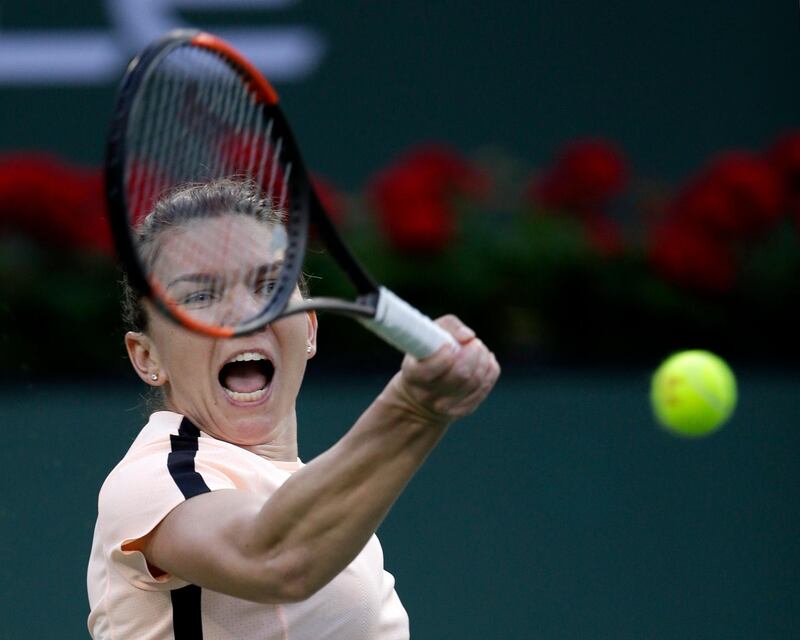 epa06597149 Simona Halep of Romania in action against  Caroline Dolehide of USA  during the BNP Paribas Open at the Indian Wells Tennis Garden in Indian Wells, California, USA, 11 March 2018.  EPA/PAUL BUCK